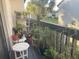 Balcony filled with potted plants, greenery, and a view of the neighborhood at 4419 S Semoran Blvd # 7, Orlando, FL 32822