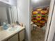 Neat bathroom with a single vanity, neutral walls, and a colorful shower curtain at 4419 S Semoran Blvd # 7, Orlando, FL 32822