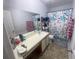 Functional bathroom with a vanity, mirror, and shower featuring a blue floral curtain at 4419 S Semoran Blvd # 7, Orlando, FL 32822