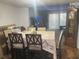 Formal dining room boasts wood floors, a large decorative dining table and an antique grandfather clock at 4419 S Semoran Blvd # 7, Orlando, FL 32822