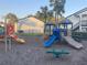 Outdoor playground area offering colorful play structures and surrounded by manicured landscaping at 4419 S Semoran Blvd # 7, Orlando, FL 32822