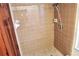 Shower featuring tile surround, showerhead and grab bar at 4516 Summergrove Ave, Orlando, FL 32812