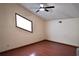 Bedroom featuring laminate floors, a ceiling fan and natural light at 4516 Summergrove Ave, Orlando, FL 32812