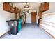 Spacious garage with ample storage cabinets, shelving, and newly painted floor at 4516 Summergrove Ave, Orlando, FL 32812