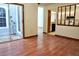 Open-concept living area with laminate floors, and access to kitchen at 4516 Summergrove Ave, Orlando, FL 32812