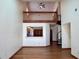 Open-concept living room with wood floors and view of the upstairs loft at 4516 Summergrove Ave, Orlando, FL 32812