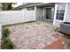 Enclosed brick patio with white fence provides private outdoor living space at 4516 Summergrove Ave, Orlando, FL 32812