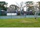 Community tennis court with well maintained court and surrounding landscape at 4516 Summergrove Ave, Orlando, FL 32812