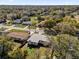 An aerial view showcasing the home's fenced yard and location in a tree-filled neighborhood at 4521 Jim Glenn Dr, Orlando, FL 32808