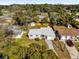 An aerial view showcases the home's lot with its mature landscaping and neighborhood at 4521 Jim Glenn Dr, Orlando, FL 32808
