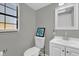 Clean bathroom with natural light, toilet, and vanity with modern fixtures at 4521 Jim Glenn Dr, Orlando, FL 32808