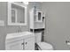 Bathroom with added storage above the toilet and modern vanity fixtures at 4521 Jim Glenn Dr, Orlando, FL 32808
