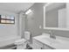 Bathroom with subway tiled shower/tub, toilet, and vanity with modern fixtures at 4521 Jim Glenn Dr, Orlando, FL 32808