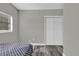 Bedroom featuring wood-look flooring, closet, and natural light from a window at 4521 Jim Glenn Dr, Orlando, FL 32808
