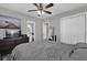 Comfortable bedroom with neutral walls, large closet, and ensuite bathroom access at 4521 Jim Glenn Dr, Orlando, FL 32808