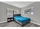 Bedroom with neutral walls, wood-look floors and window views at 4521 Jim Glenn Dr, Orlando, FL 32808