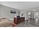 Open-concept layout showcasing the living room, kitchen, and modern flooring at 4521 Jim Glenn Dr, Orlando, FL 32808