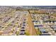 Expansive aerial view of a community showcasing numerous homes with solar panels at 455 Eaglecrest Dr, Haines City, FL 33844