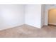Bright bedroom features neutral carpet, white walls, and natural light, creating a blank canvas ready for customization at 455 Eaglecrest Dr, Haines City, FL 33844