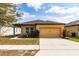 Charming one-story home with a two-car garage and well-maintained lawn at 455 Eaglecrest Dr, Haines City, FL 33844