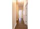 Long hallway featuring hard surface floors and doors to multiple rooms at 455 Eaglecrest Dr, Haines City, FL 33844