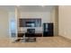 Modern kitchen with granite countertops, black appliances, and dark wood cabinets for ample storage at 455 Eaglecrest Dr, Haines City, FL 33844