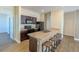 Well-equipped kitchen featuring dark cabinetry, a stone-look countertop, and a breakfast bar with seating at 455 Eaglecrest Dr, Haines City, FL 33844