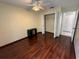 Inviting bedroom with hardwood flooring, ample closet space, and neutral wall color at 5323 Alcom Dr, Orlando, FL 32812
