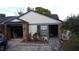 Charming single-story home with brick accents, white siding, and an attached garage at 5323 Alcom Dr, Orlando, FL 32812