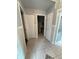 Hallway with tile flooring and doors leading to other rooms at 5323 Alcom Dr, Orlando, FL 32812