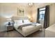 Comfortable bedroom featuring a neutral color palette, a queen-size bed, and a window at 561 Pebble Beach Dr, Davenport, FL 33896