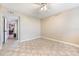 Empty bedroom with tile floors and a view into a room with a desk at 5842 Peregrine Ave # C01, Orlando, FL 32819