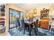 Cozy dining area with stylish decor and a sliding glass door offering water views at 5842 Peregrine Ave # C01, Orlando, FL 32819