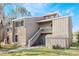 Charming condo with two stories and a stairway, surrounded by lush greenery and a serene landscape at 5842 Peregrine Ave # C01, Orlando, FL 32819