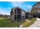 Two story condo unit boasts a screened in porch on both levels and lush green lawn at 5842 Peregrine Ave # C01, Orlando, FL 32819