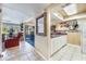 Well-equipped kitchen leads to a cozy living area, perfect for seamless entertaining and daily living at 5842 Peregrine Ave # C01, Orlando, FL 32819