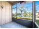 Screened-in porch offering peaceful waterfront views of the community at 5842 Peregrine Ave # C01, Orlando, FL 32819