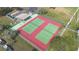 Aerial view of tennis courts and recreation area in a well-maintained community at 5842 Peregrine Ave # C01, Orlando, FL 32819