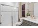 Elegant bathroom featuring a glass-enclosed shower and a modern vanity with stylish fixtures and decor at 6319 Dew Drop Loop, St Cloud, FL 34771
