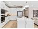 Stylish kitchen with an island, stainless steel appliances, and an open layout to the living area at 6319 Dew Drop Loop, St Cloud, FL 34771