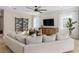Inviting living room with ample seating, stylish decor, and plenty of natural light at 6319 Dew Drop Loop, St Cloud, FL 34771