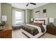 This bedroom boasts neutral tones with a seating area and a serene view from the bright window at 6319 Dew Drop Loop, St Cloud, FL 34771
