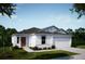 New construction of a one-story home with red entry door, white stucco, dark roof, and an attached two-car garage at 6634 Lullaby Way, Mascotte, FL 34753
