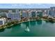 Gorgeous aerial view showcasing a lush landscape and serene lake with a charming fountain, surrounded by a vibrant cityscape at 101 S Eola Dr # 1001, Orlando, FL 32801