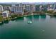 Breathtaking aerial view of a tranquil lake with a fountain, framed by lush greenery and a vibrant cityscape at 101 S Eola Dr # 1001, Orlando, FL 32801