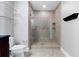 Bright bathroom features a spacious glass-enclosed shower with tile surround and modern fixtures at 101 S Eola Dr # 1001, Orlando, FL 32801