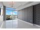 Modern bedroom featuring geometric wallpaper, chandelier, and a large window at 101 S Eola Dr # 1001, Orlando, FL 32801