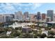 Scenic city view featuring modern buildings and lush green trees creating a harmonious urban landscape at 101 S Eola Dr # 1001, Orlando, FL 32801