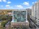 Condo building features modern architecture, floor-to-ceiling windows, and luxury amenities like rooftop pool at 101 S Eola Dr # 1001, Orlando, FL 32801