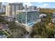 Condominium exterior showing facade with rooftop pool and parking garage at 101 S Eola Dr # 1001, Orlando, FL 32801